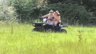 Crazy Naked Matures in floppy hats on a Quad bike
