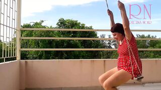 Depraved housewife swinging without panties on a swing c1