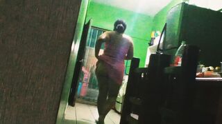 chubby mexican wife preparing dinner in the kitchen