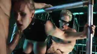 Big tit leather whore is dual penetrated while strapped down