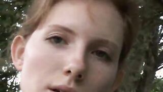 Redhead pisses outdoors