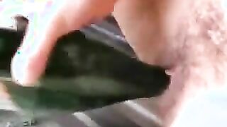 Bit titted woman fucks herself with wine bottle