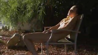 Beautiful thin girl undressing in a wild