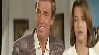 Sophie Marceau gets into bed topless