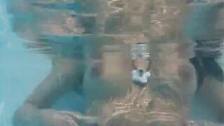 Naughty girl fingering in the pool