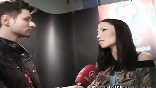 Hot brunette gets naked in front of fans