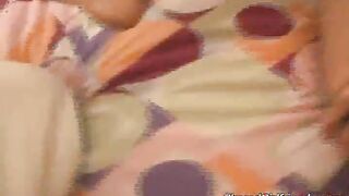 Busty Latina playing with glass dildo