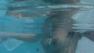 Naughty girl strip in the pool
