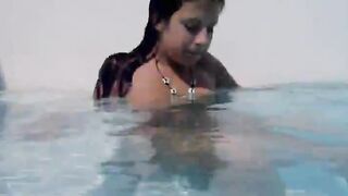Naughty girl teasing in the pool