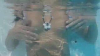 Naughty girl teasing in the pool