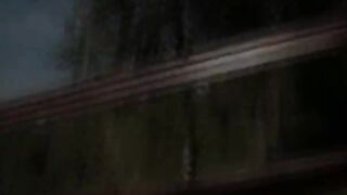 blackhair toying outside on the bench