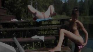 Two babes playing with vibrators outside