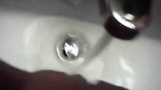teen washes pussy in sink
