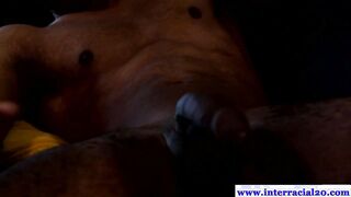 Black muscled jock masturbates on couch
