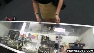 Brunette babe showing her tits at the pawn shop