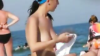 Topless Beach Babe Rubbing Lotion On Her Body