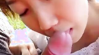 Asian Beauty Giving A Blowjob Outside