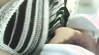 Pregnant asian breast feeds doll in car