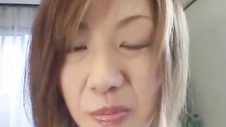 Oriental preggo plays with her tits