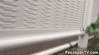 Asian babe caught peeing outside