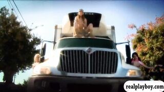 Two busty babes take off bikinis and driving an air glider