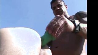 Muscular latino brings a toy to a picnic