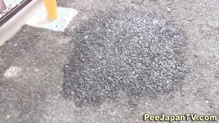 Asian girl pees in public street