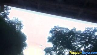 Gay asian twinks kissing outdoors
