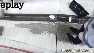 Asian babes piss outdoors and leave puddle