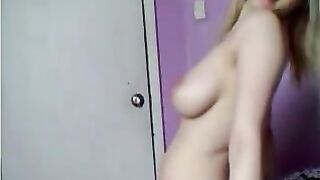 Blonde babe with busty tits strips and teases