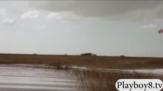 Topless babes riding on big crocodile during their visit