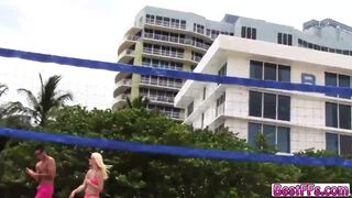 Girls playing with the guys on the beach gets wet and wild