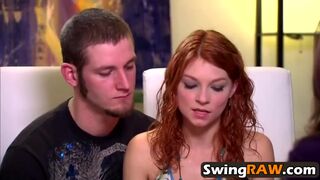 Young couple enjoys hot threesome in a swinger party