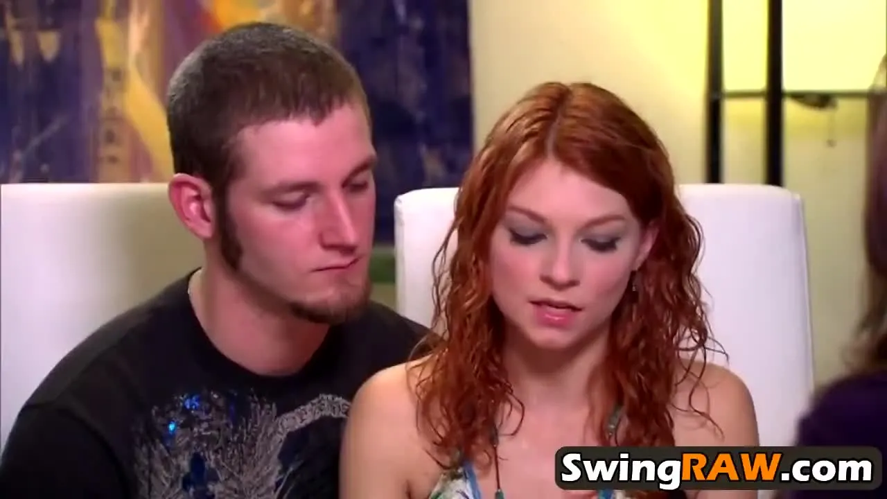 Young couple enjoys hot threesome in a swinger party image image