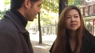 MILF Asian gives head to big cock