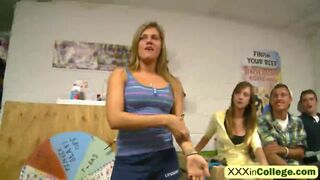 Busty college girl dances and teases guy while they play wheel of fun