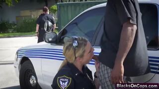 Lovely blonde cop crushing big black cock on her hungry mouth