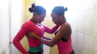 Two slutty African chicks have some great lesbian action in a public toilet