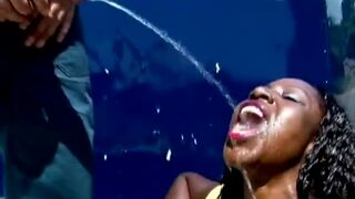 Exploited African slut sucks white dicks and get blasted with piss