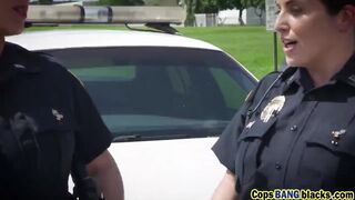Busty cop bitches share a big black dick in the middle of the street