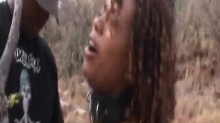 Slave from Africa abused by two masters outdoors