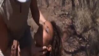 African babe gets her rough rock off outdoors