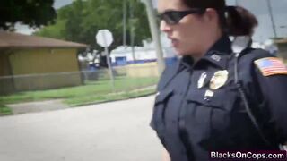Two nasty police officers sharing black cock outdoors