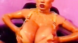 Minka Oiling Up Her Huge Balloon Boobs