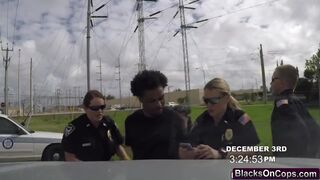 Female cops arrest a black felon and make him lick one of them's pussy