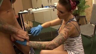 Beautiful tattoo artist satisfying a lucky client
